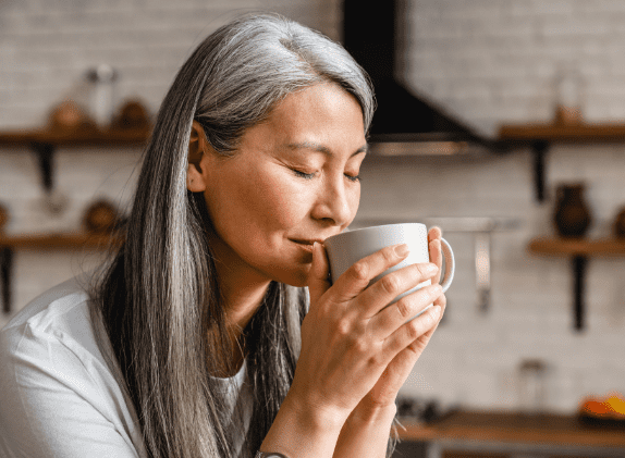 happy woman driking medicinal fungi