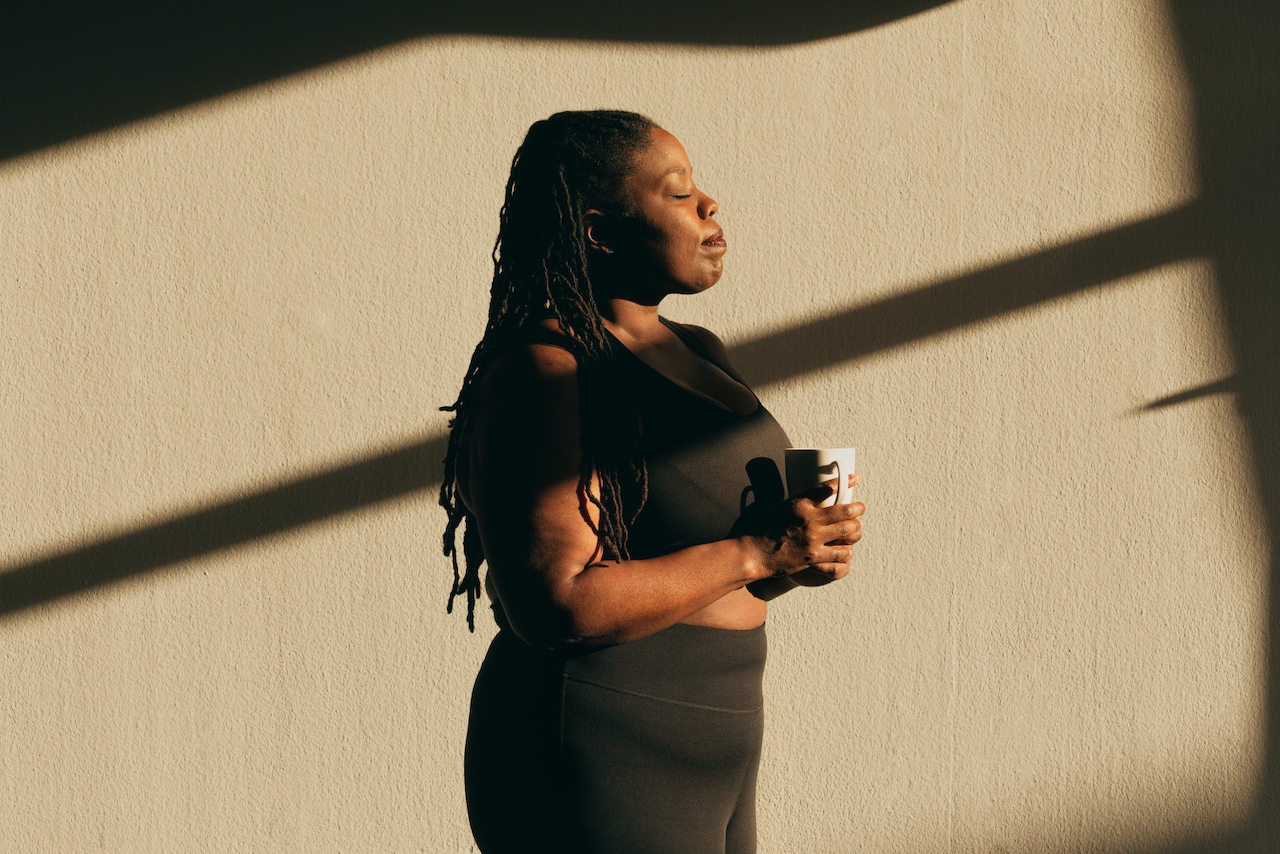 A woman of color meditating